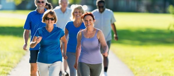 Adults participating in a wellness support group focused on healthy lifestyle habits and accountability.