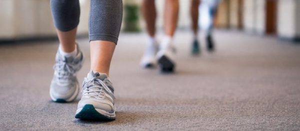 Adults participating in the Worth Township Indoor Walking Club inside the township building.